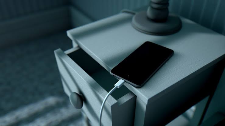 phone charging on a drawer