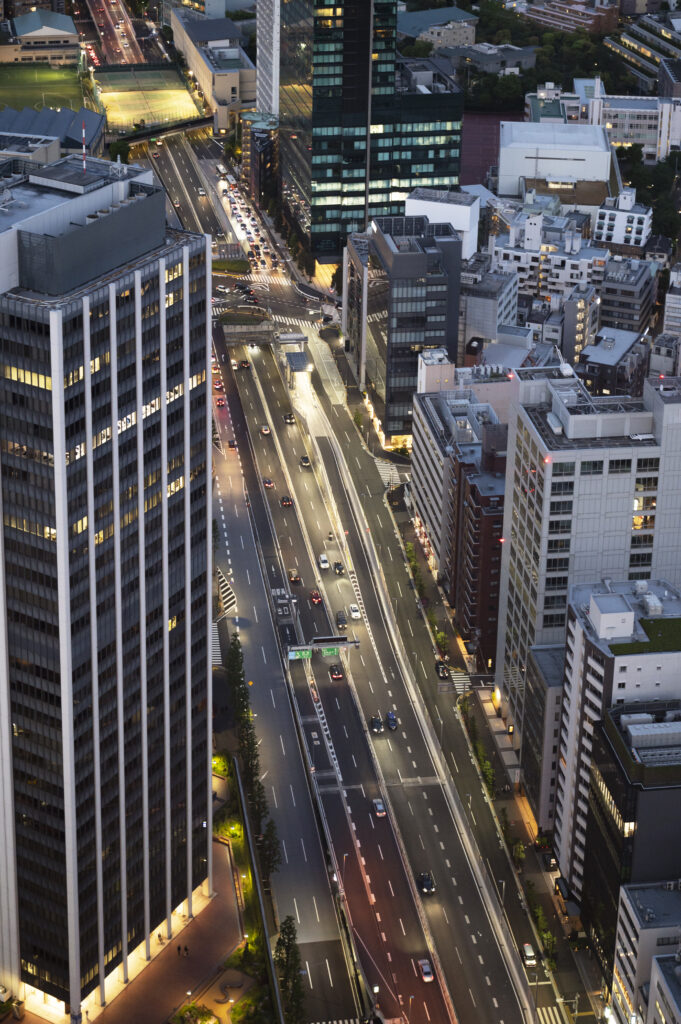 Futuristic flying cars in the sky over a modern city