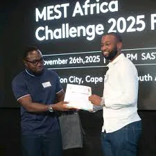 Co-founder of Black Swan, Derick Kazimoto receiving a certificate at the MEST Africa ChallengeImage source: ITWeb Africa
