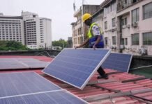 Solar Startup Ecosystem Booming in Nigeria Amid Electricity Crisis A solar startup employee installing outdoor panels Image source: Dialogue Earth